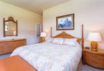 The master bedroom features a king sized bed and small private lanai